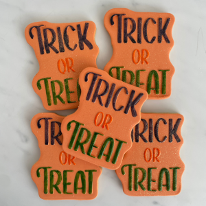 Halloween Sugar Cookie with orange fondant icing and "Trick or Treat" stamped ontop